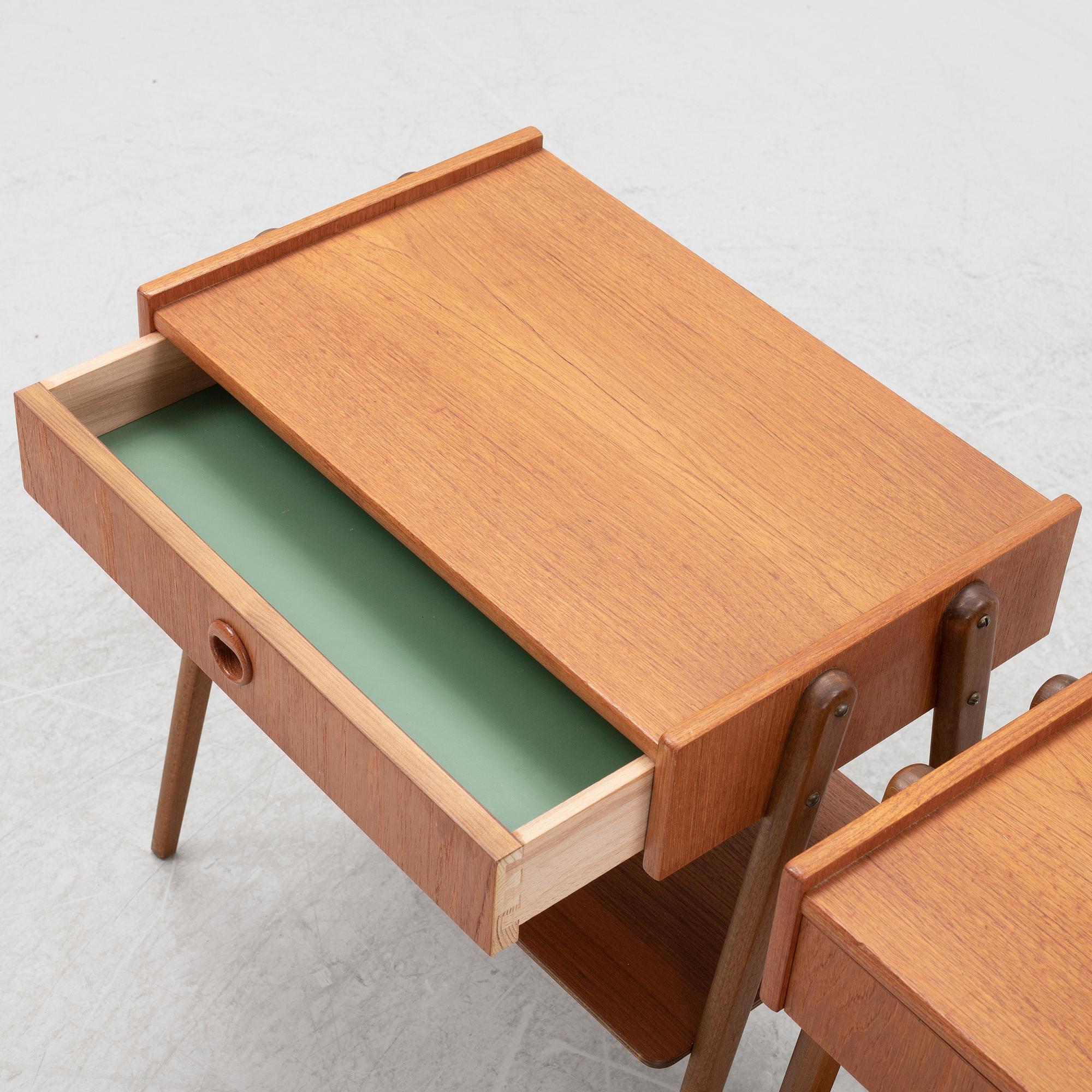 A pair of teak veneered bedside tables, 1950's/60's.