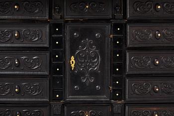 A South-German Baroque ebonized collector's cabinet on stand, circa 1700.