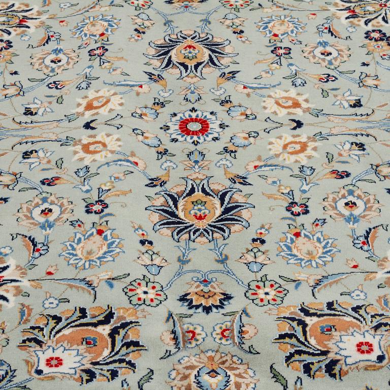 A SIGNED KESHAN RUG, 395 x 298 cm.