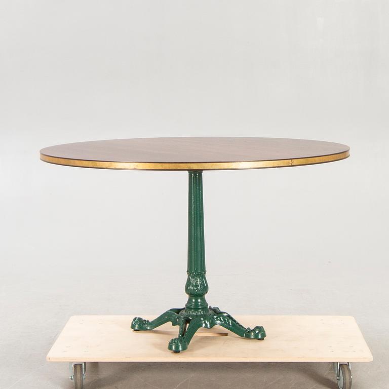 Table, cast iron base, 20th century.