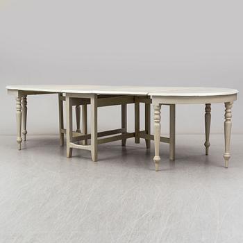 A 19th century dining table in three parts.