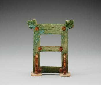 A green and brown glazed pottery stand/gate, Ming dynasty (1368-1644).