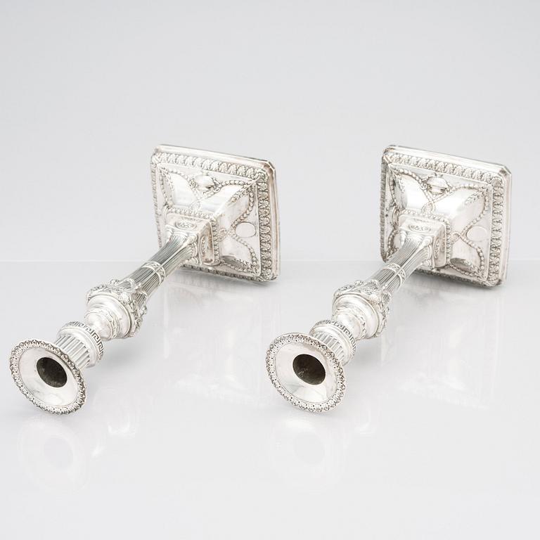 An English pair of 18th Century silver candlesticks, mark of John Winter & Co, Sheffield 1775.