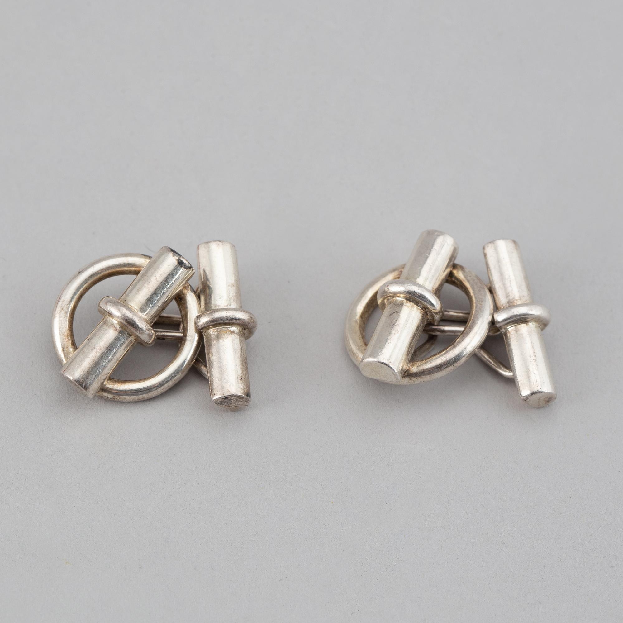 HERMÈS, a pair of silver cuff links.