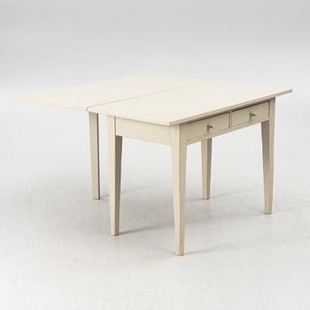 A drop-leaf table, late 19th century.