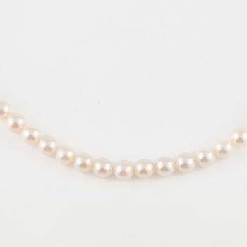 Three strands of cultured pearls, without clasps.