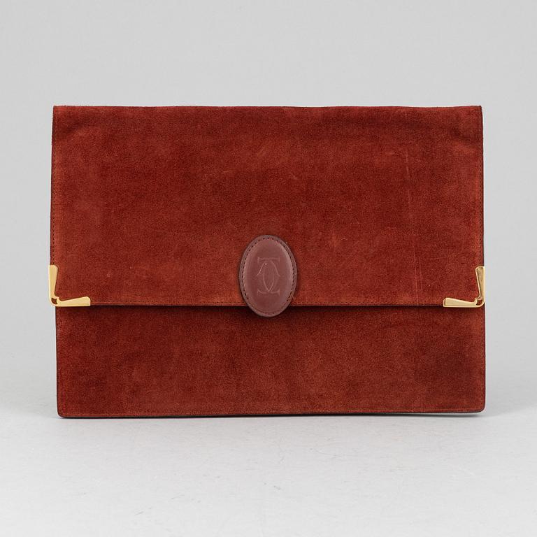 Cartier, a red suede clutch.