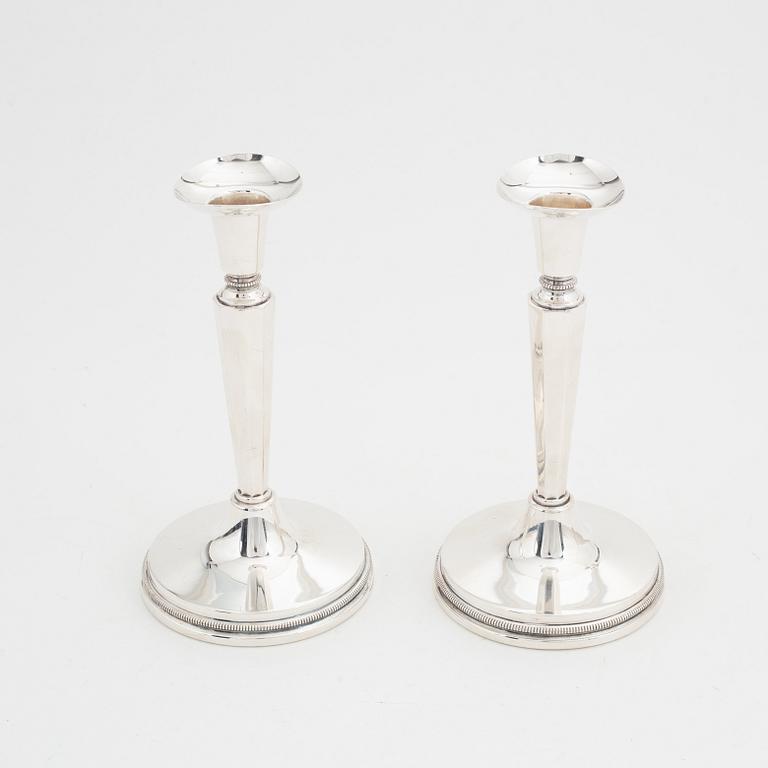 Eric Löfman, a pair of silver candlesticks, MGAB, Uppsala, 1976.