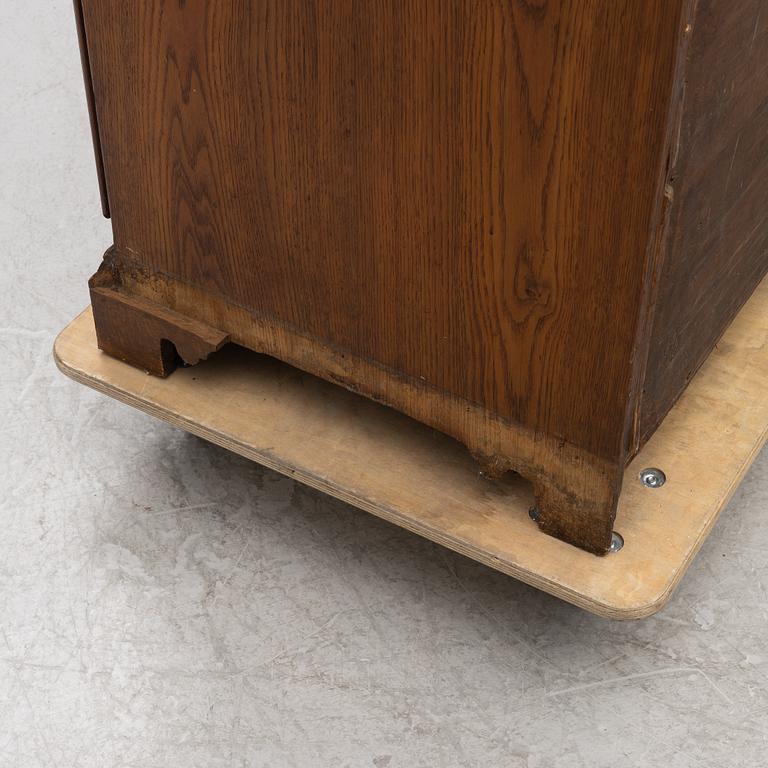 An oak secretaire, first half of the 19th century.