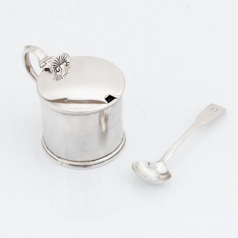 An English silver mustard pot and spoon, unidentified makers mark, London 1881 and the spoon 1874.