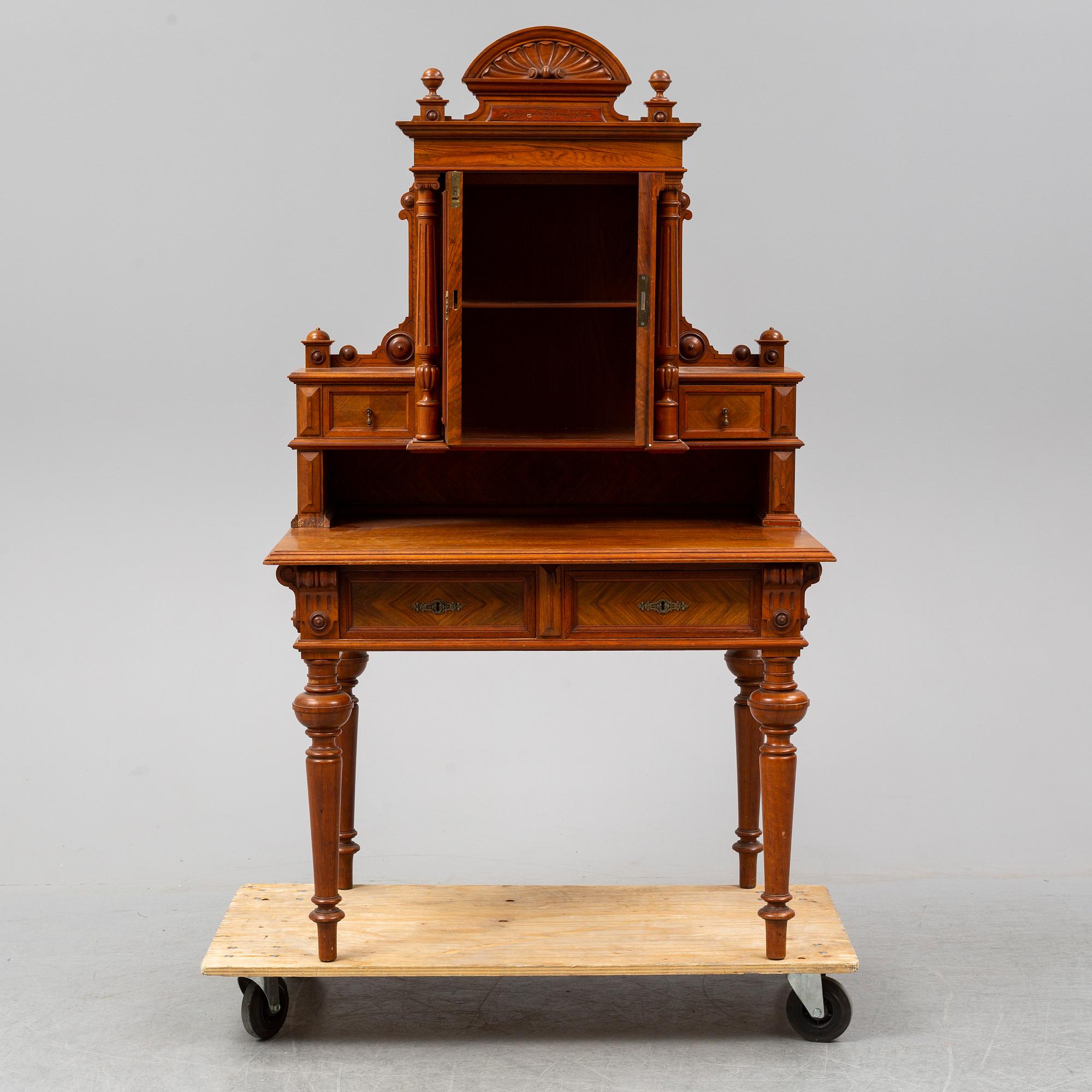 A late 19th century walnut veneered desk.
