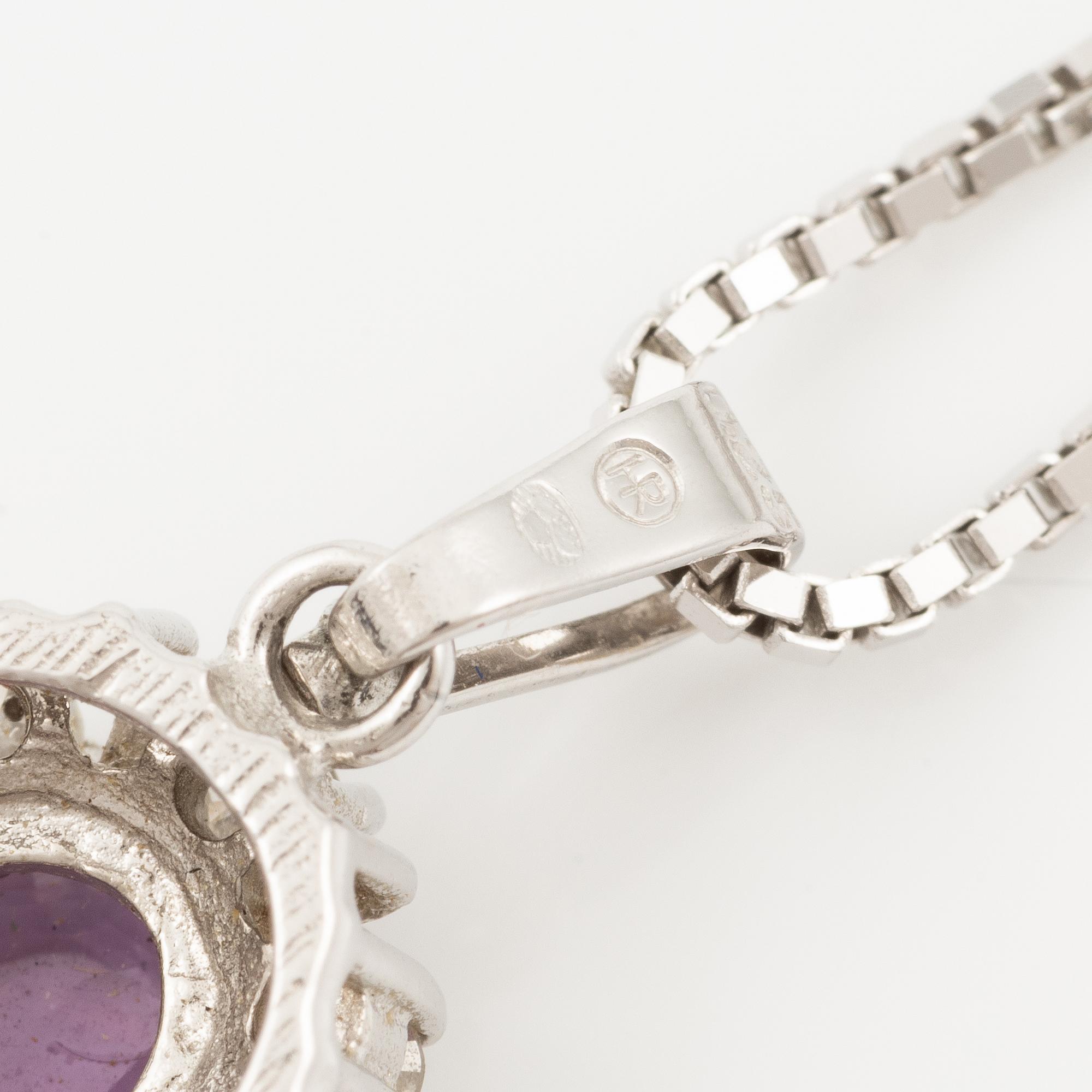 Pendant with gold chain, 
Pendant with white gold chain, 
Earrings a pair, rubies with brilliant-cut diamonds.
