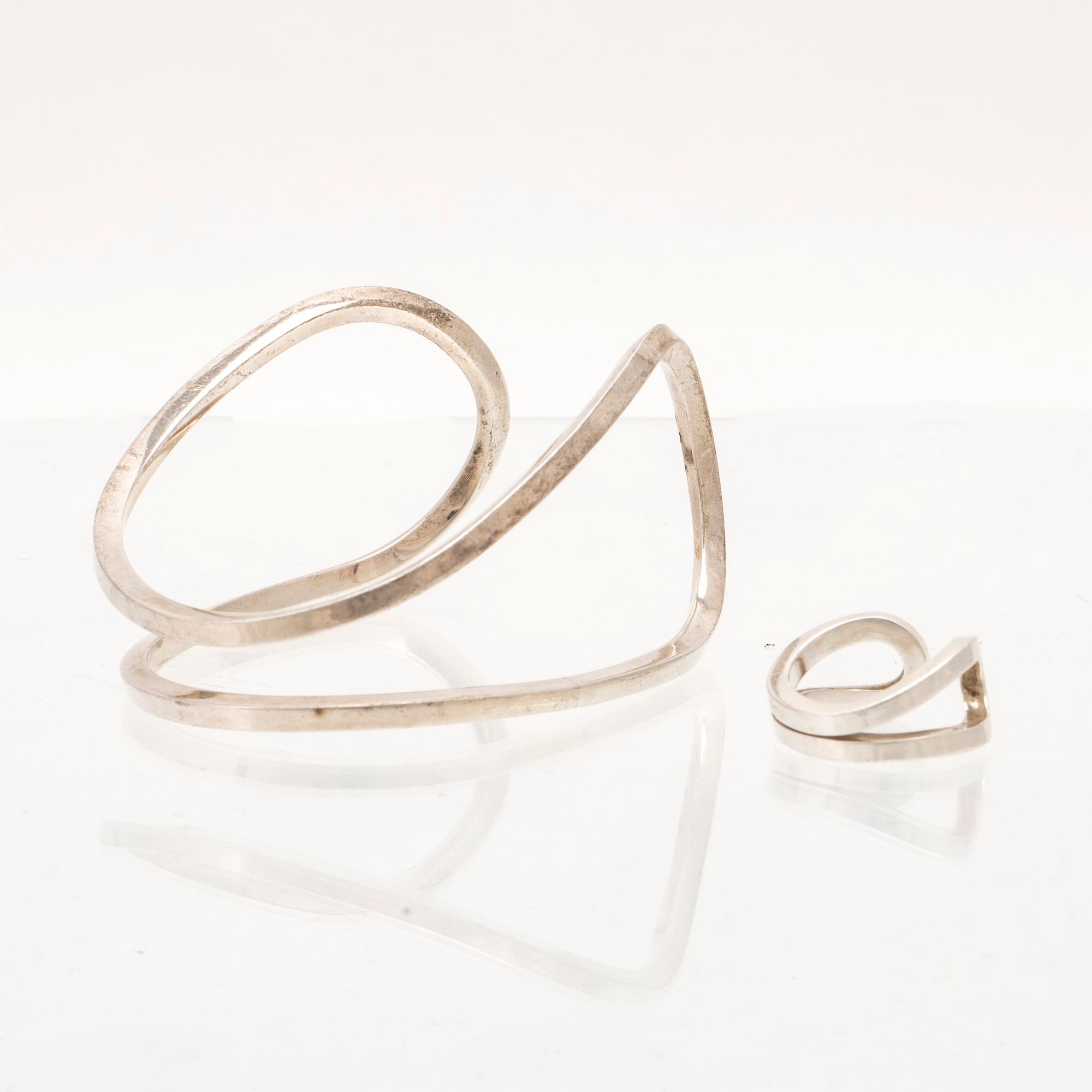 A silver ring and bracelet "loop cuff" by Efva Attling.