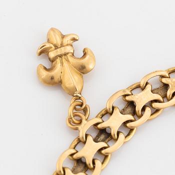 18K gold bracelet, with charms.