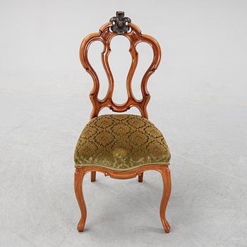 A rococo style sofa, four chairs and a table, second half of the 19th Century.