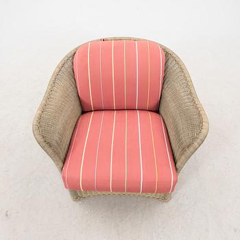 A Bonacina special edition rattan armchair 21st  century.