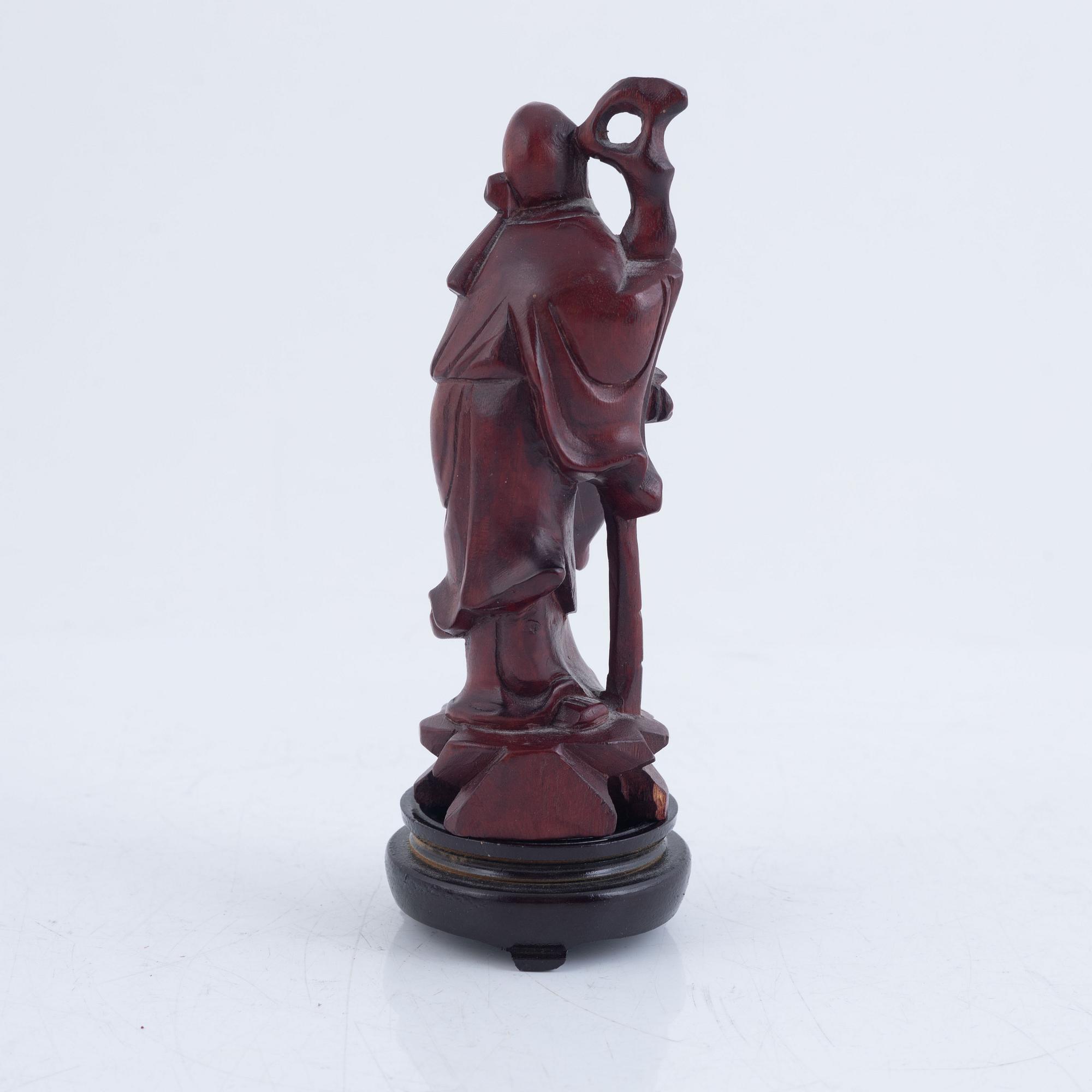 Six Chinese carved wooden figurines, 20th century.