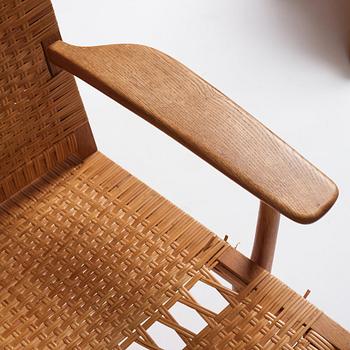 Hans J. Wegner, a pair of oak and rattan 'CH27' chairs, Carl Hansen & Søn, Odense Denmark 1950s-1960s.