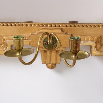 A Gustavian giltwood two-light girandole mirror by J. Åkerblad (master in Stockholm 1754-99).
