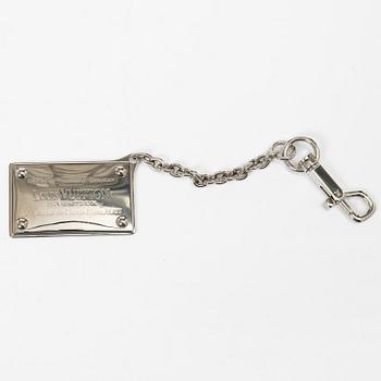 Louis Vuitton, Translation: "bag charm and case with incense".