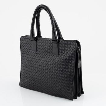 Bottega Veneta, a black leather briefcase.