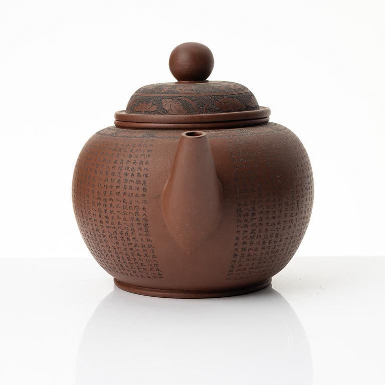A 'calligraphy' yixing teapot, China, later part of the 1900s.