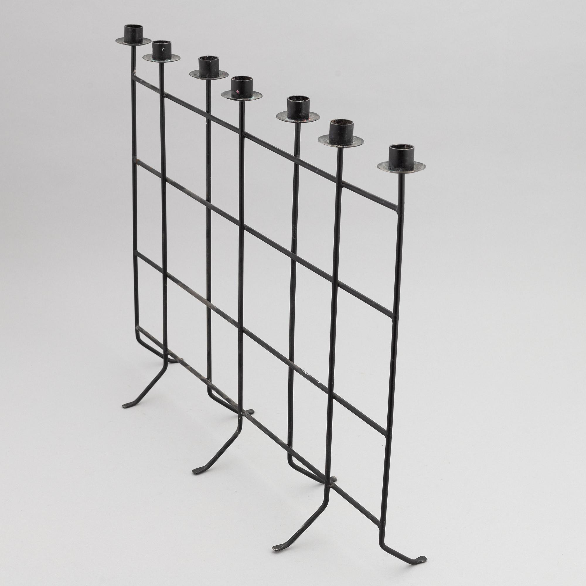 An iron candlestick, second half of the 20th Century.