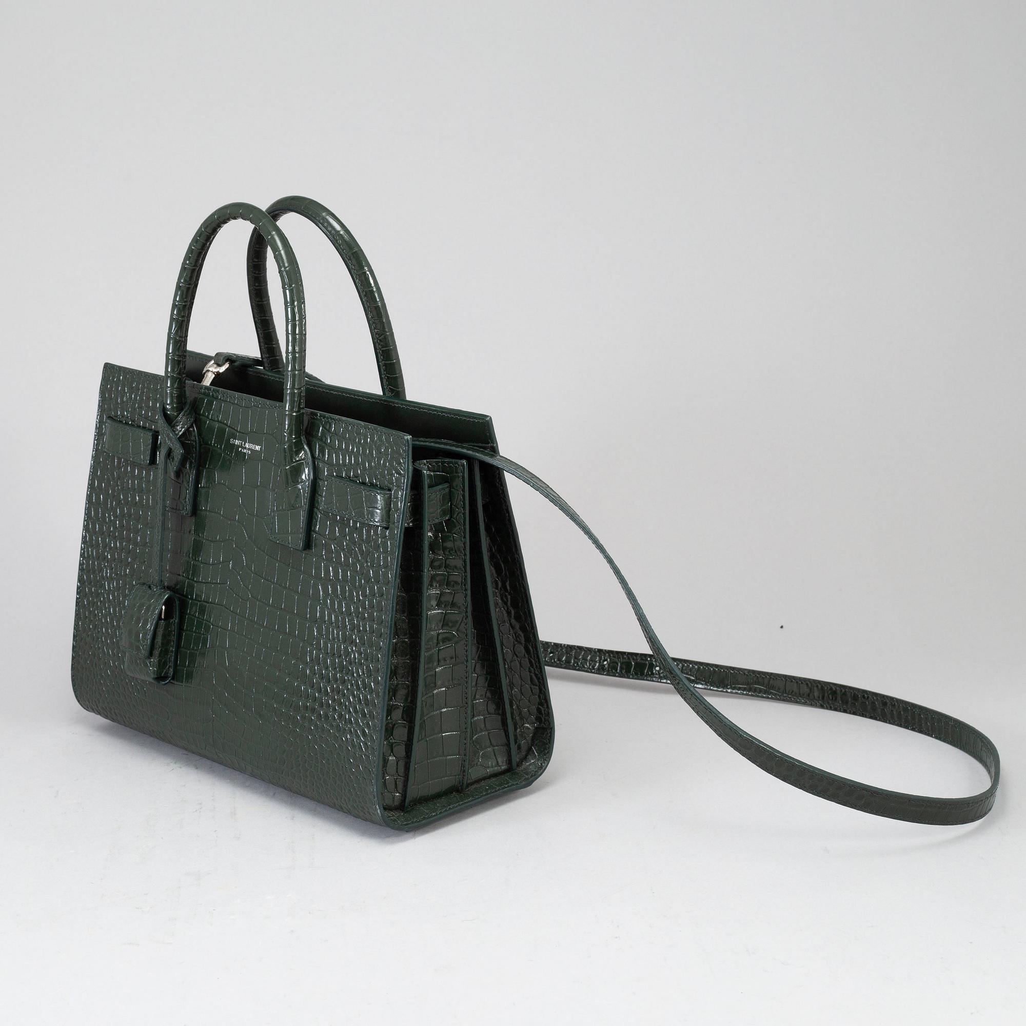 YVES SAINT LAURENT a crocodile embossed green leather Sac du Jour Baby bag 2018. Bukowskis