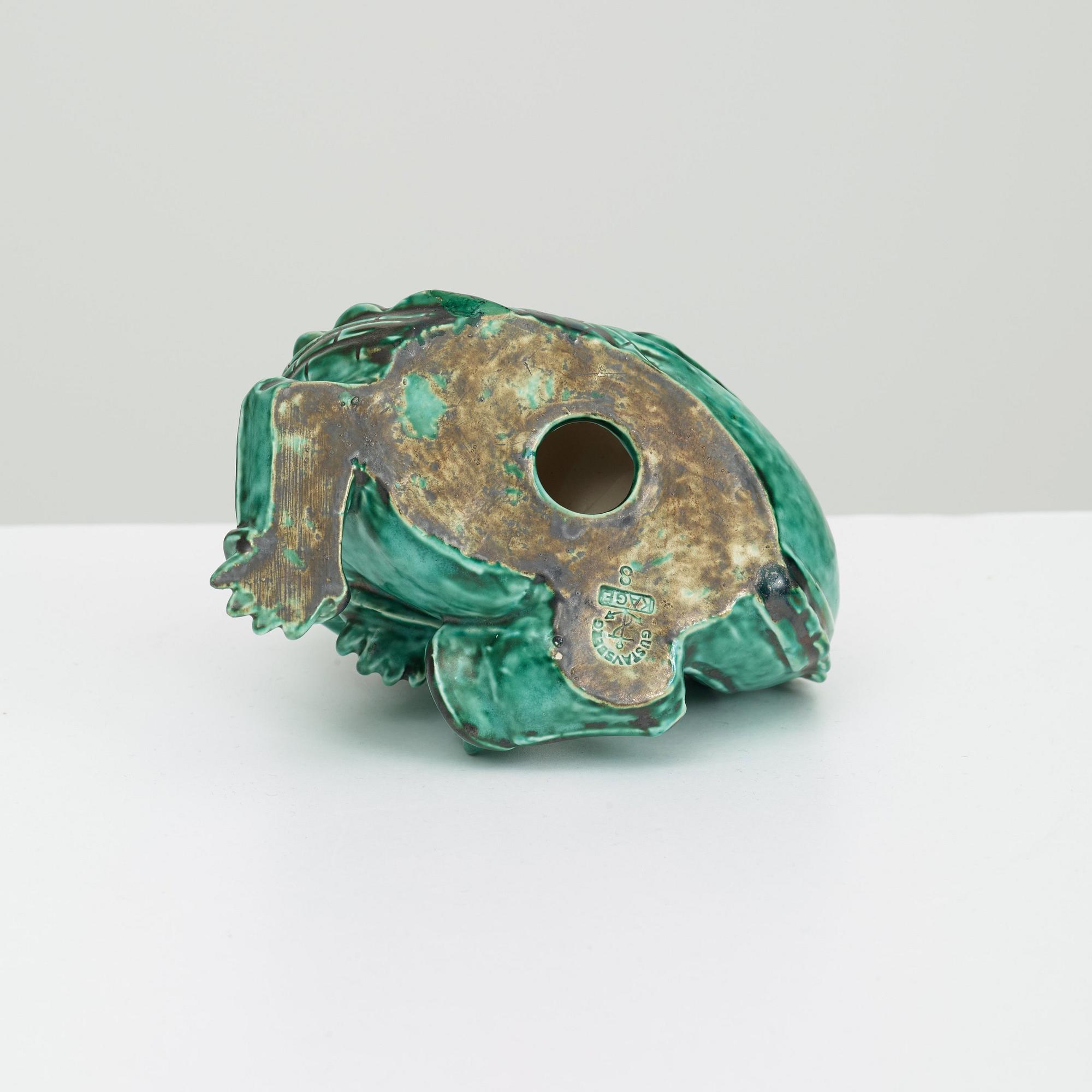 A Wilhelm Kåge stoneware sculpture of a dragon puppy, Gustavsberg ca 1940.