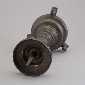 A 18th century pewter candlestick.