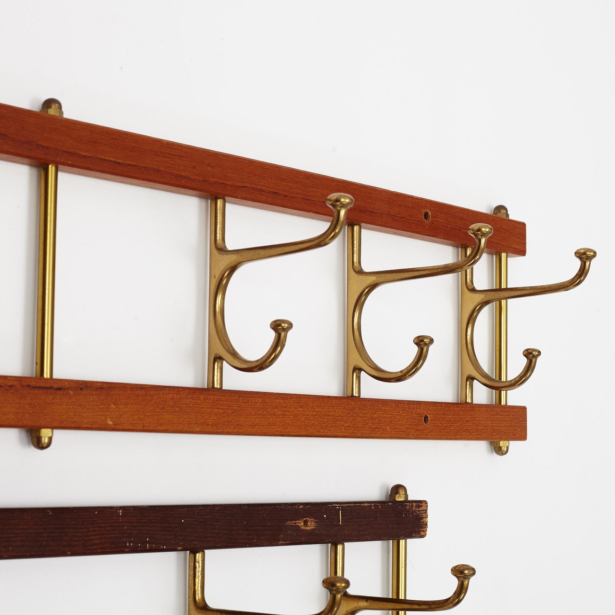 Two 'Dekorativ' coat hangers, Skogslunds metallgjuteri, Anderstorp, mid 20th Century.
