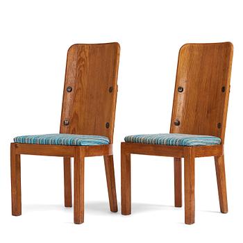 338. Axel Einar Hjorth, a pair of stained pine "Lovö" chairs, Nordiska Kompaniet, Sweden 1930's.