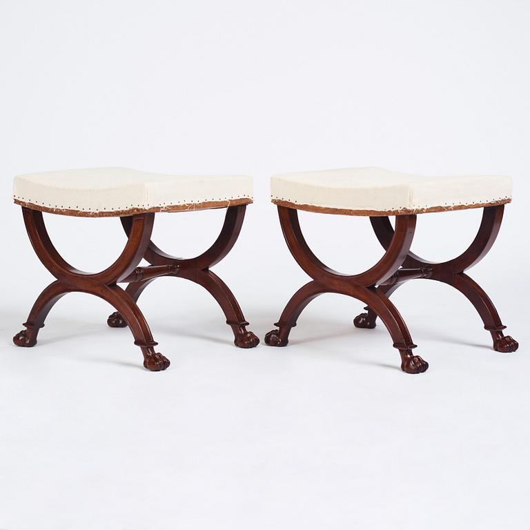 A pair of Directoire mahogany stools, circa 1800.