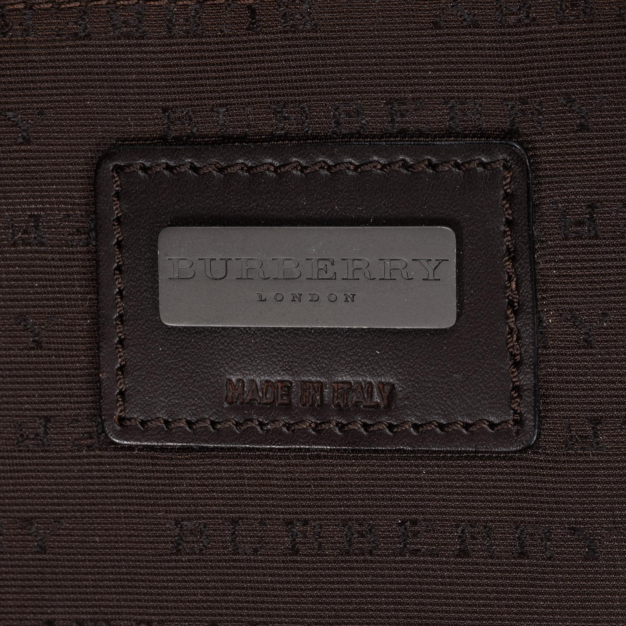 Burberry, a Nova Check canvas suitcase.