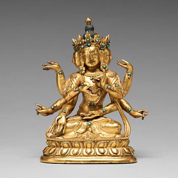 694. A Sino-Tibetan gilt copper alloy figure of Ushnisha Vinaya, late 18th century/circa 1800.