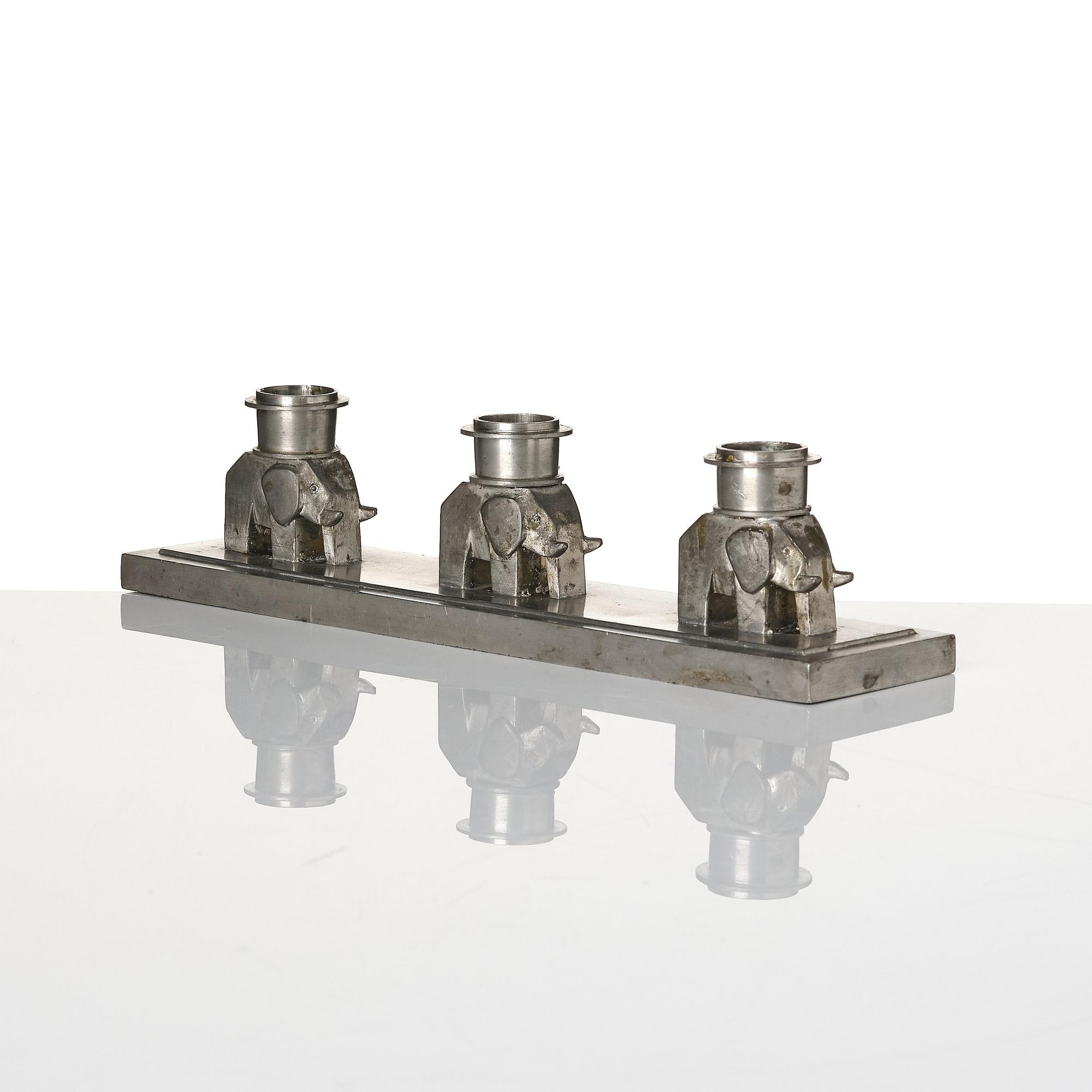 Lidvard Hallset, a pewter candelabrum for three candles, model "1545", Firma Svenskt Tenn, Stockholm 1930.