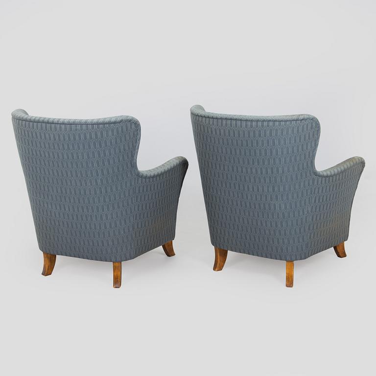 A pair of mid-20th century armchairs.