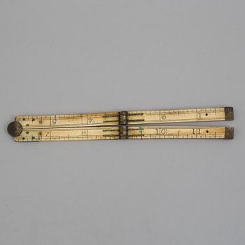 A 19TH CENTURY BONE FOLDING RULER.