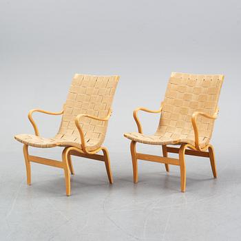 A pair of 'Eva' easy chairs by Bruno Mathsson for Firma Karl Mathsson, dated 1974.