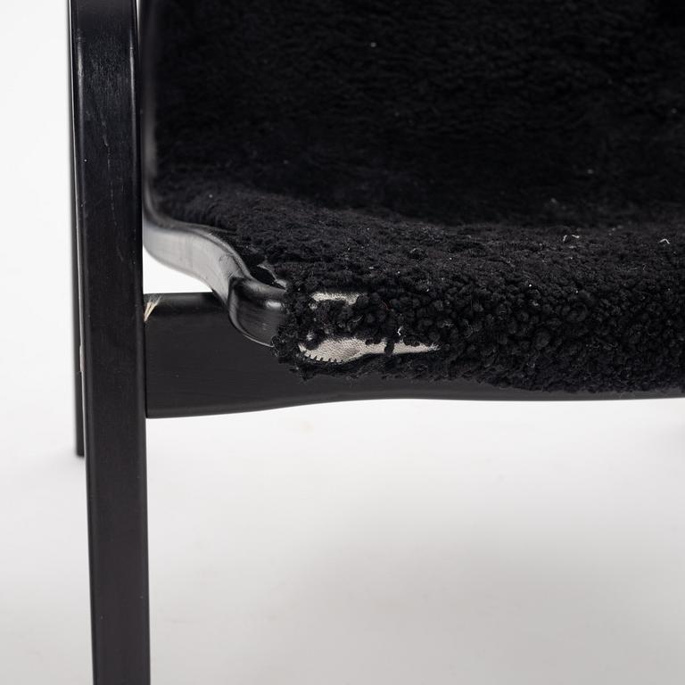 Yngve Ekström, A black "Lamino", easy chair with ottoman, Swedese, Sweden 21st Century.