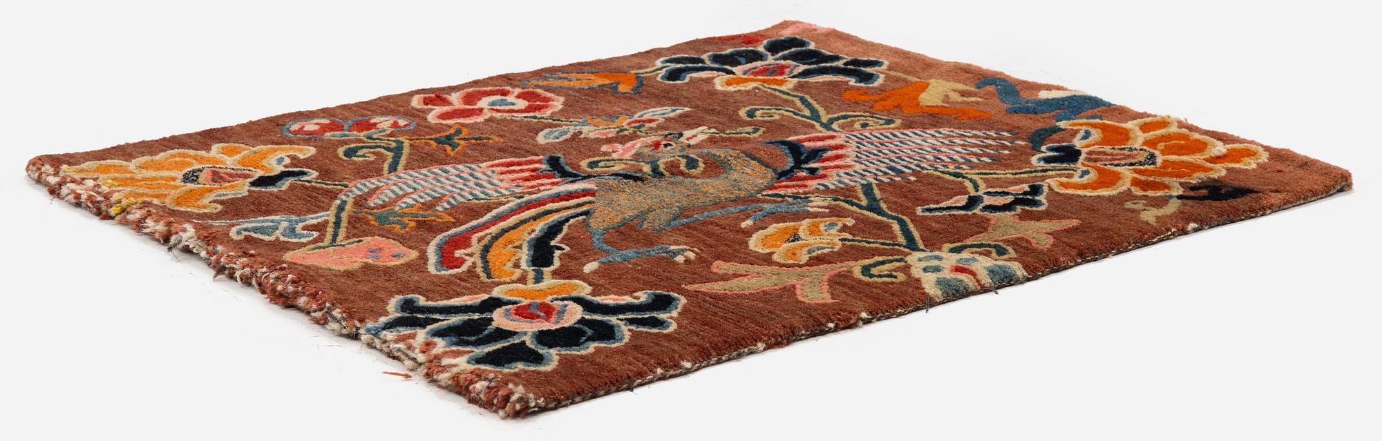 An antique 'Khagangma' rug, Tibet, around 1900. c. 74x63 cm.