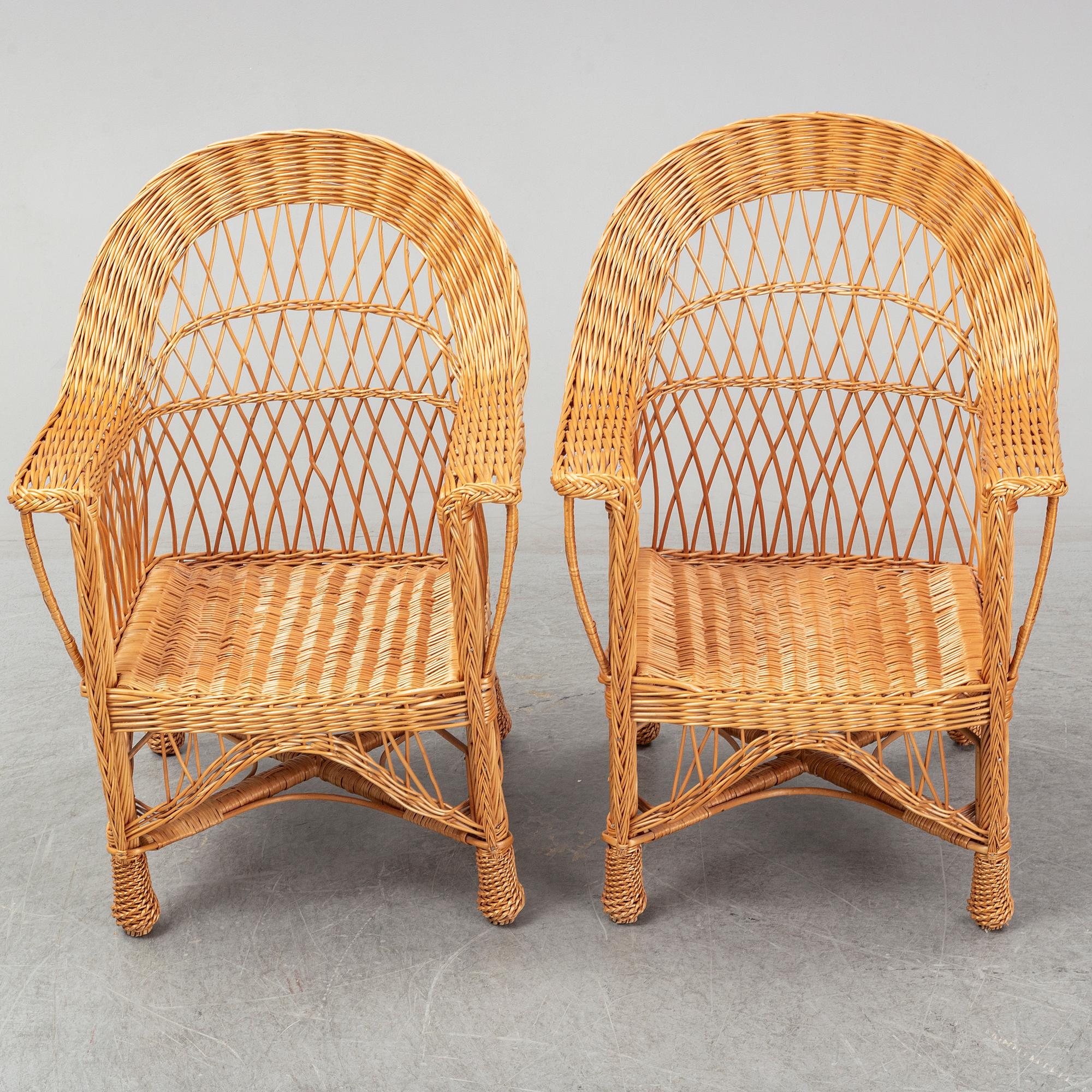 A pair of 1970s/1980s rattan armchairs.