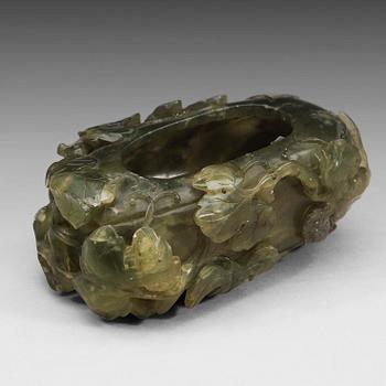 57. A green stone bruchwasher, Qing dynasty, circa 1900.