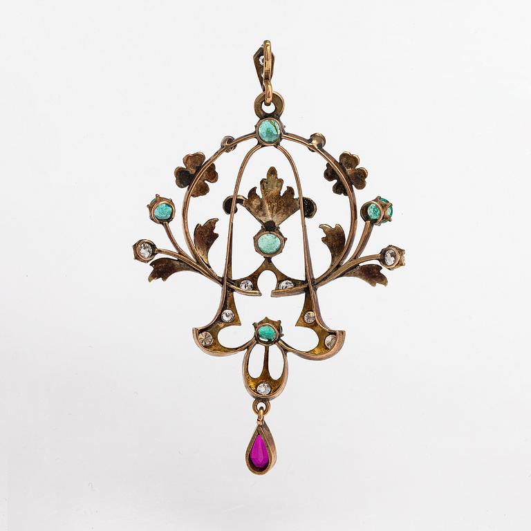 A 14K gold pendant with emeralds, rubies and diamonds ca. 0.45 ct in total. Russia early 20th century.