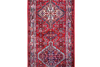 A Hamadan carpet, c. 304 x 84 cm.