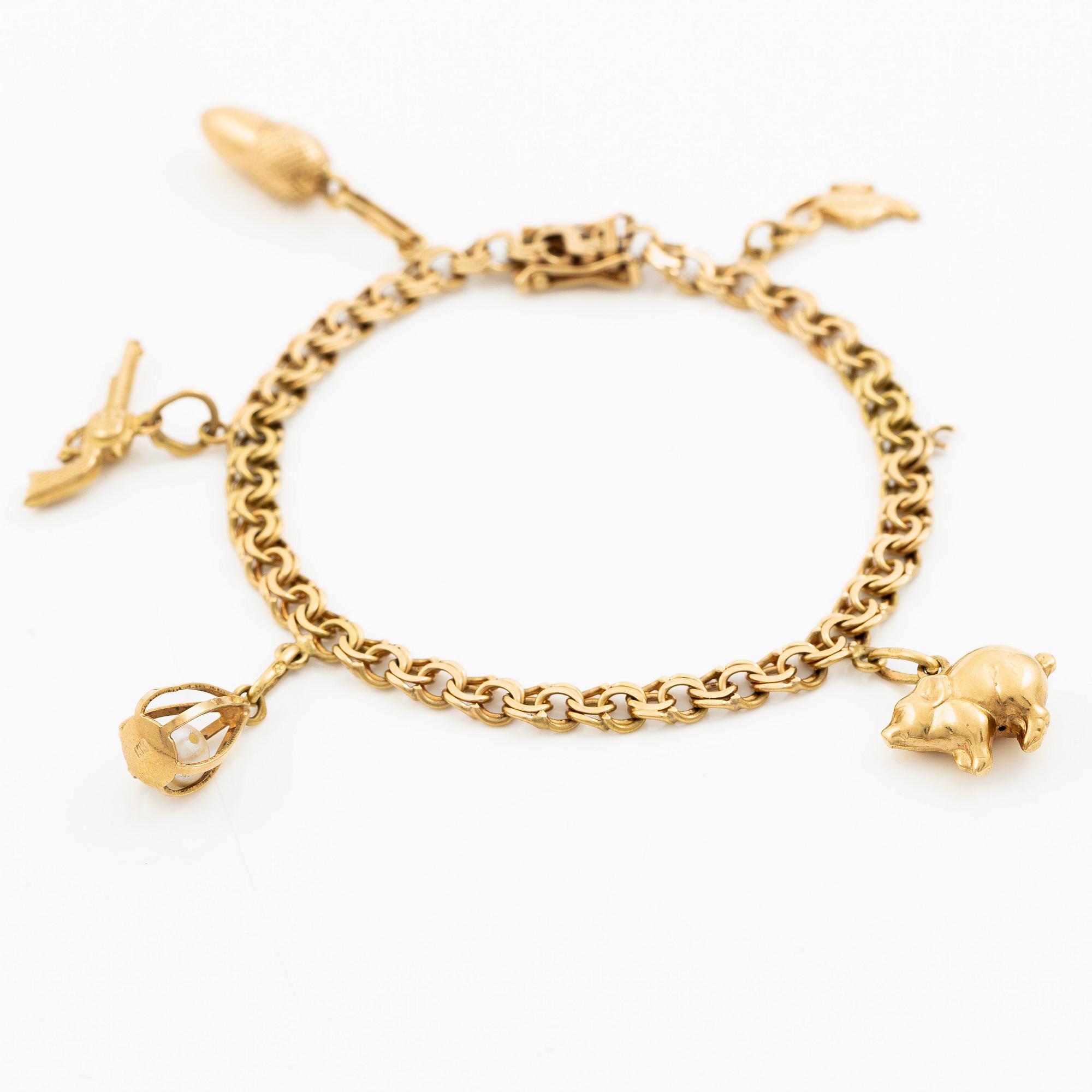 Bracelet, 18K gold with charms.