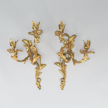 A pair of brass sconces, circa 1900.