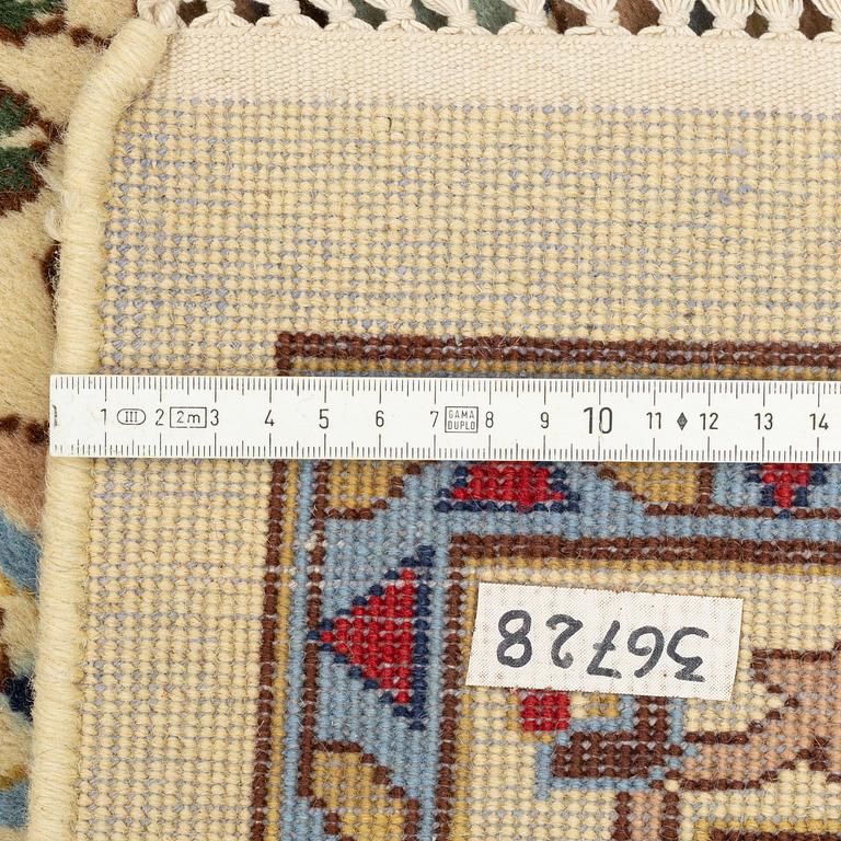 A carpet, signed, circa 286 x 212 cm.