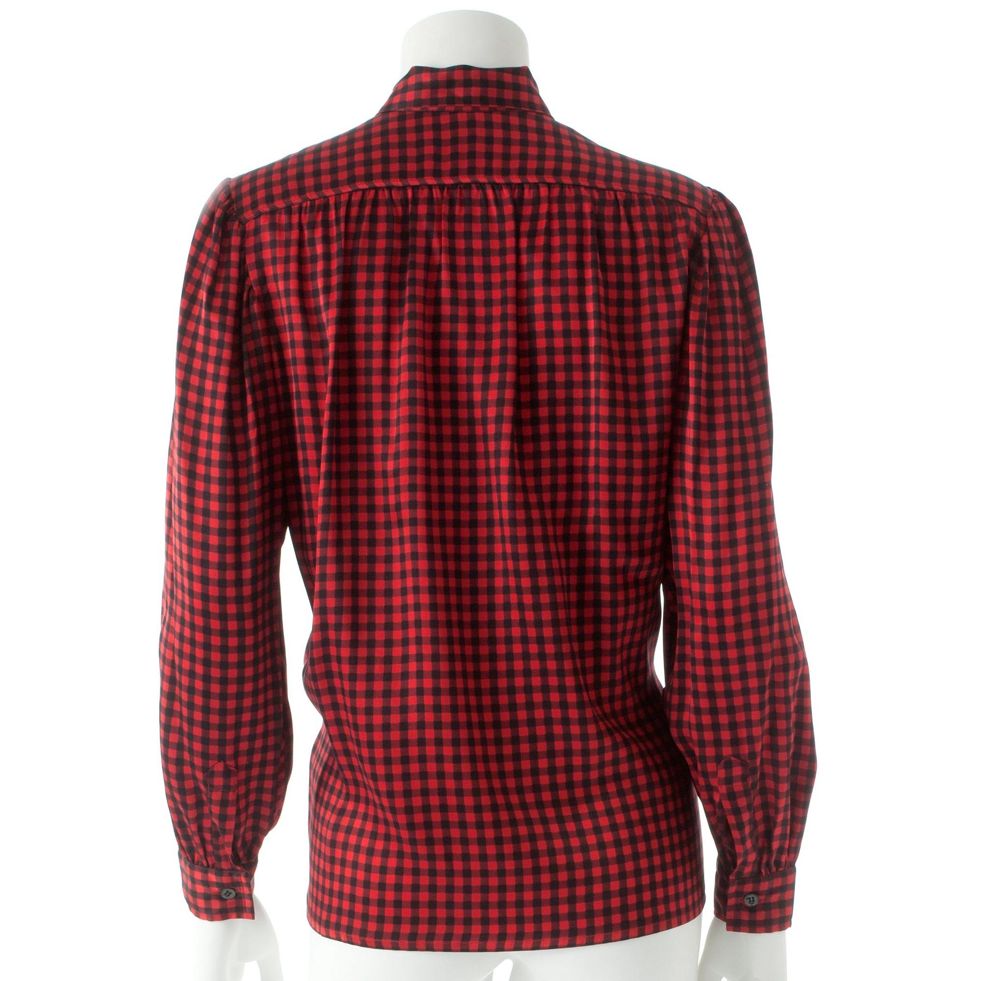 YVES SAINT LAURENT, a red and black silk blouse.