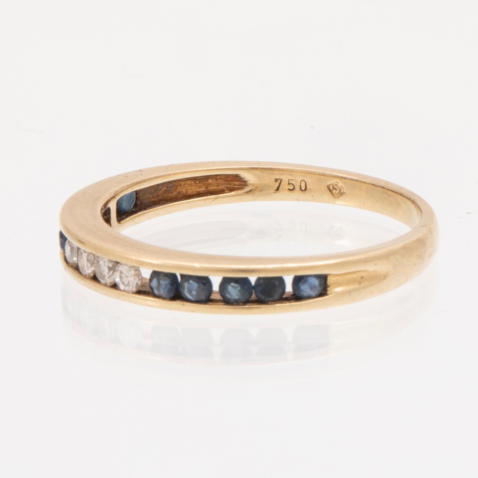 An 18K gold ring and a pair of earrings by H. Stern set with round brilliant cut diamonds and sapphires.